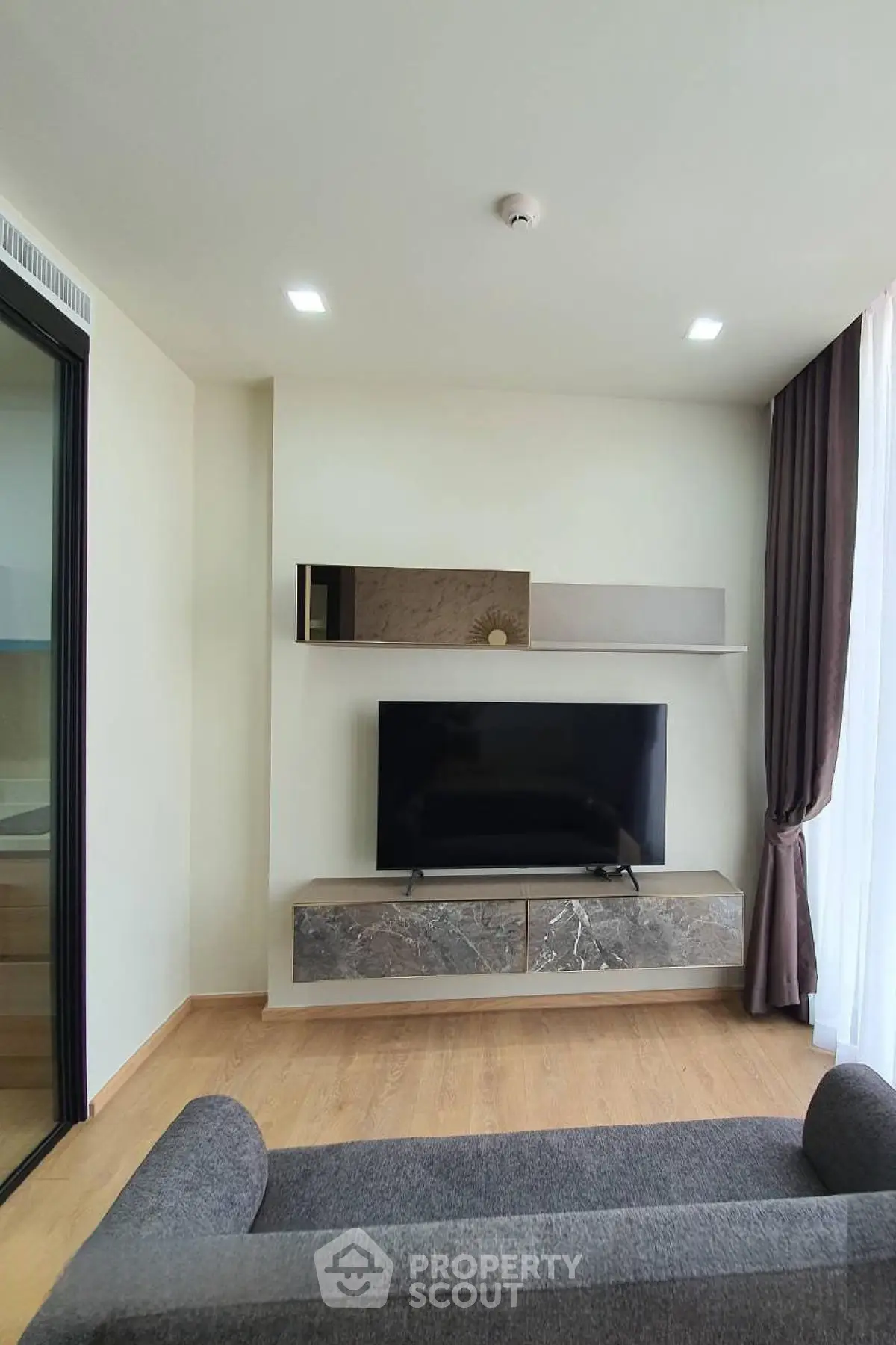 Modern living room with sleek TV setup and elegant decor