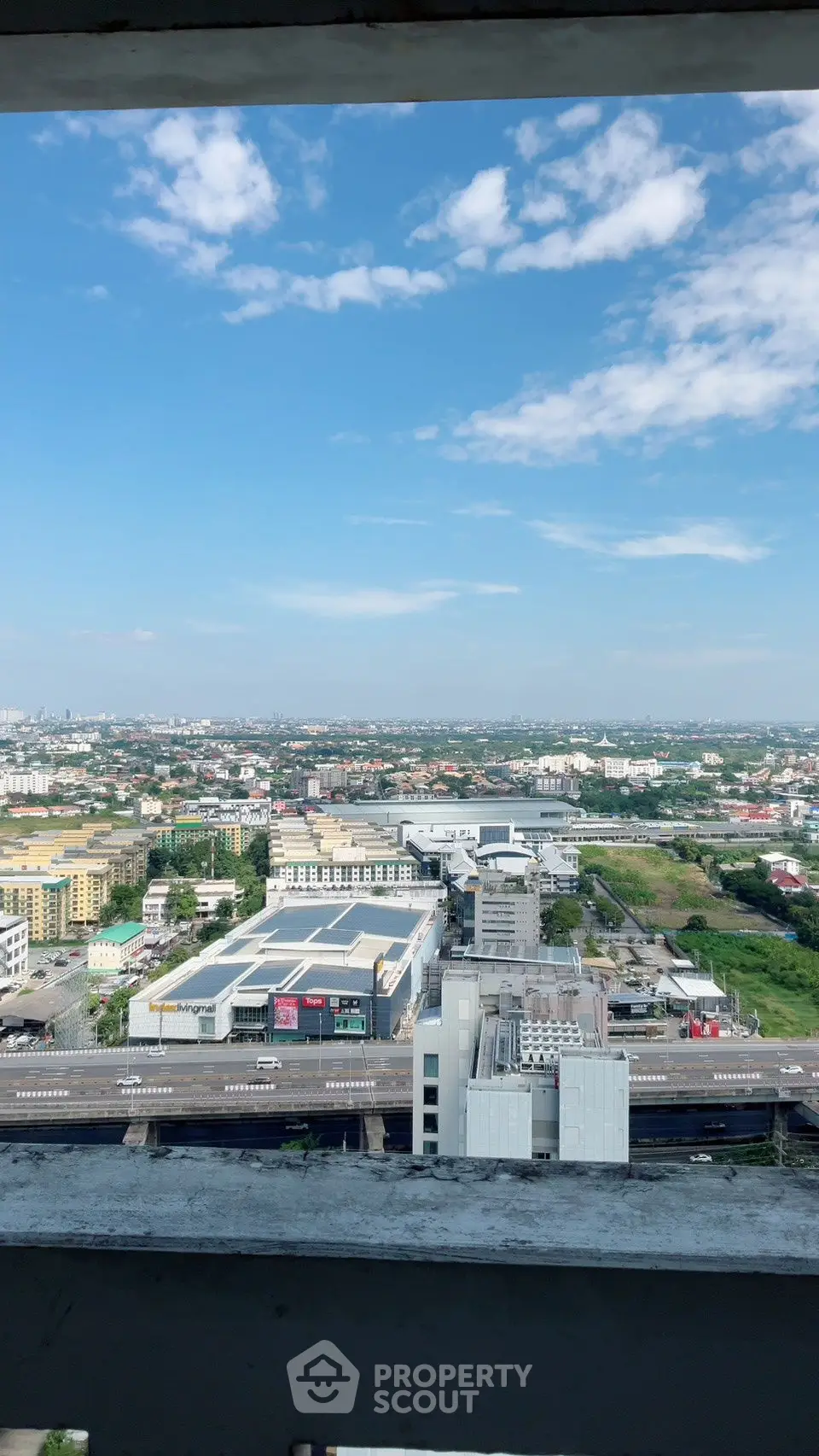 Stunning panoramic cityscape view from high-rise building balcony