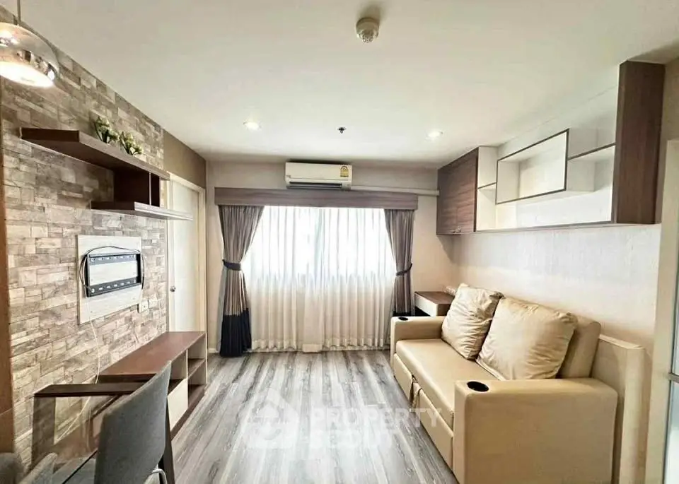 Modern living room with stylish decor and natural light, featuring a cozy sofa and elegant curtains.