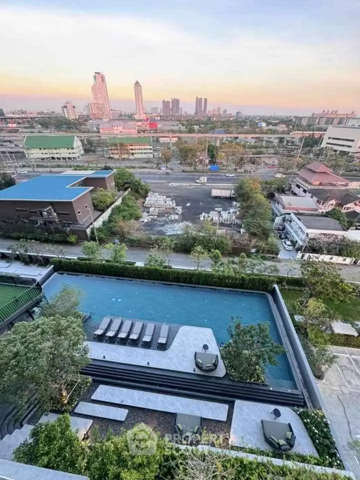 Stunning rooftop pool with panoramic city views in a modern urban setting.