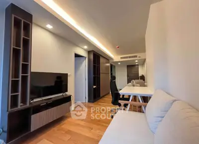 Modern living room with wooden flooring and sleek furniture design