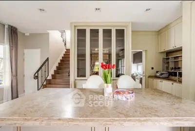 Luxurious kitchen with marble countertop and elegant cabinetry in a modern home.