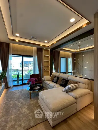 Luxurious living room with modern decor and large windows offering a stunning view, perfect for relaxation.