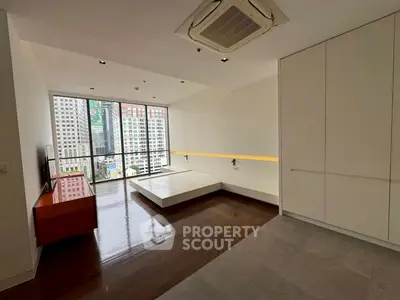 Spacious modern living room with city view and sleek design