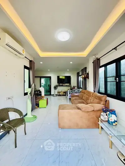 Spacious modern living room with elegant lighting and comfortable seating