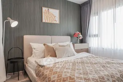 Cozy bedroom with stylish decor and natural light