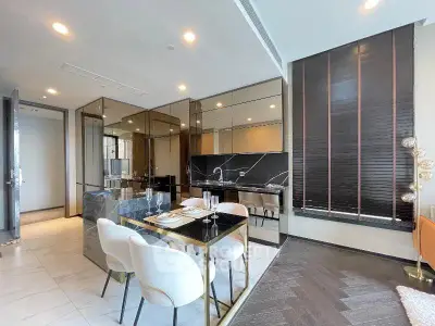 Luxurious modern dining area with elegant decor and sleek kitchen design