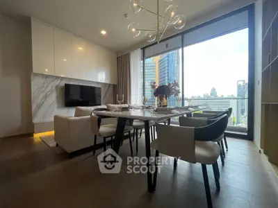 Luxurious modern living room with city view, elegant dining area, and stylish decor in high-rise apartment.