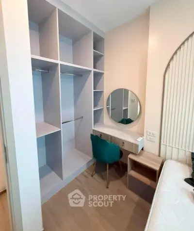Modern bedroom with built-in closet and stylish vanity area