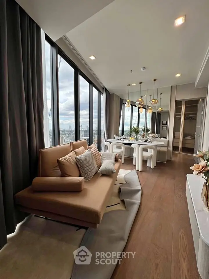 Luxurious modern living room with panoramic city views and elegant dining area, featuring stylish decor and ample natural light.