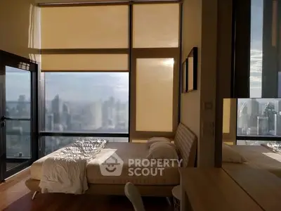 Luxurious bedroom with stunning city view and modern decor