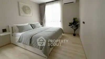 Modern minimalist bedroom with stylish decor and natural light