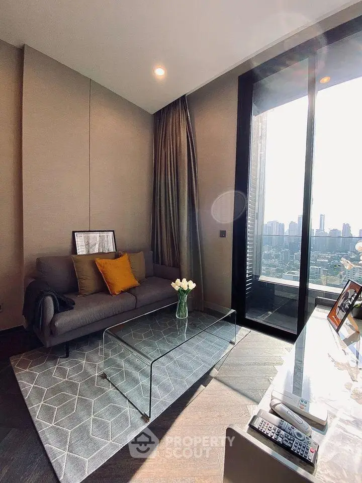 Modern living room with city view, stylish decor, and floor-to-ceiling windows.