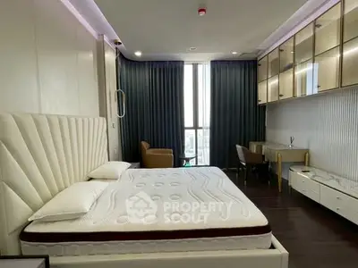 Luxurious modern bedroom with stylish decor and large window view