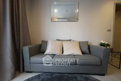 Modern living room with stylish gray sofa and elegant decor