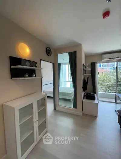 Modern apartment interior with open layout and balcony view