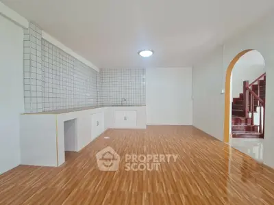 Spacious kitchen with open layout and modern tiled backsplash