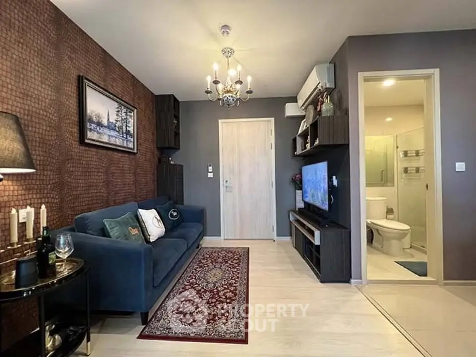 Stylish living room with elegant decor and open view to modern bathroom, perfect for urban living.