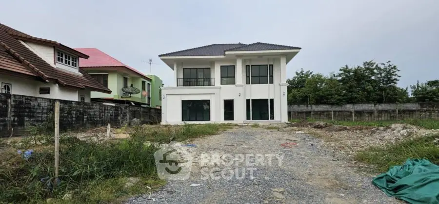 Modern two-story house with spacious yard and contemporary design