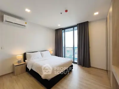 Modern bedroom with balcony view and elegant decor