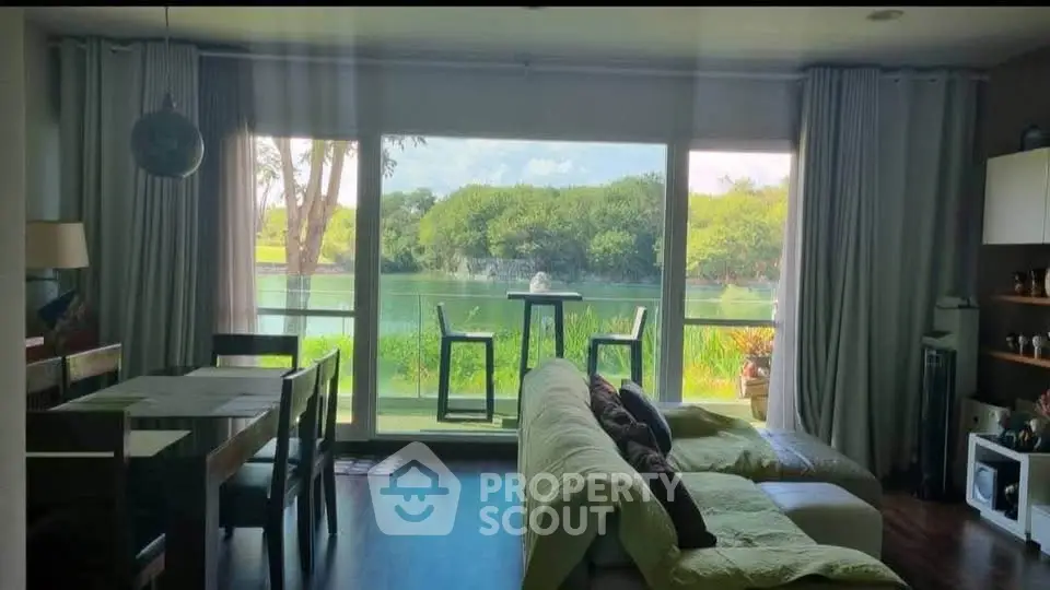 Spacious living room with stunning lake view and modern decor