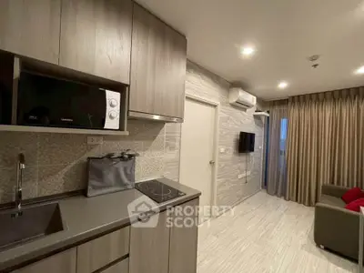 Modern kitchen and living area with sleek design and cozy ambiance