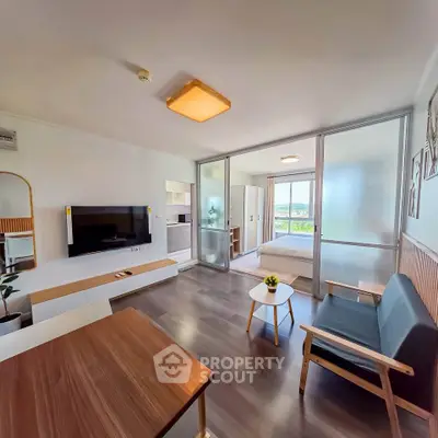 Modern open-plan living room with sleek furniture and natural light