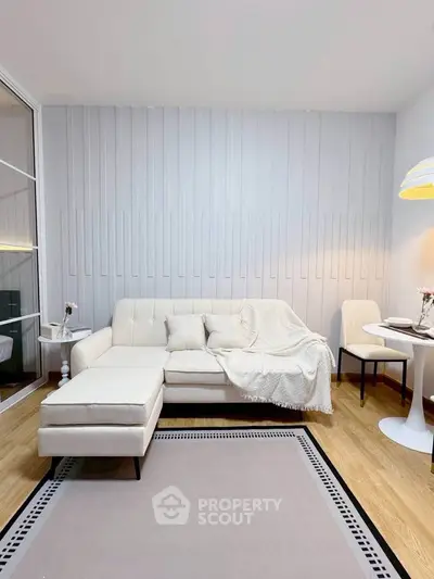 Modern living room with elegant white sofa and cozy decor