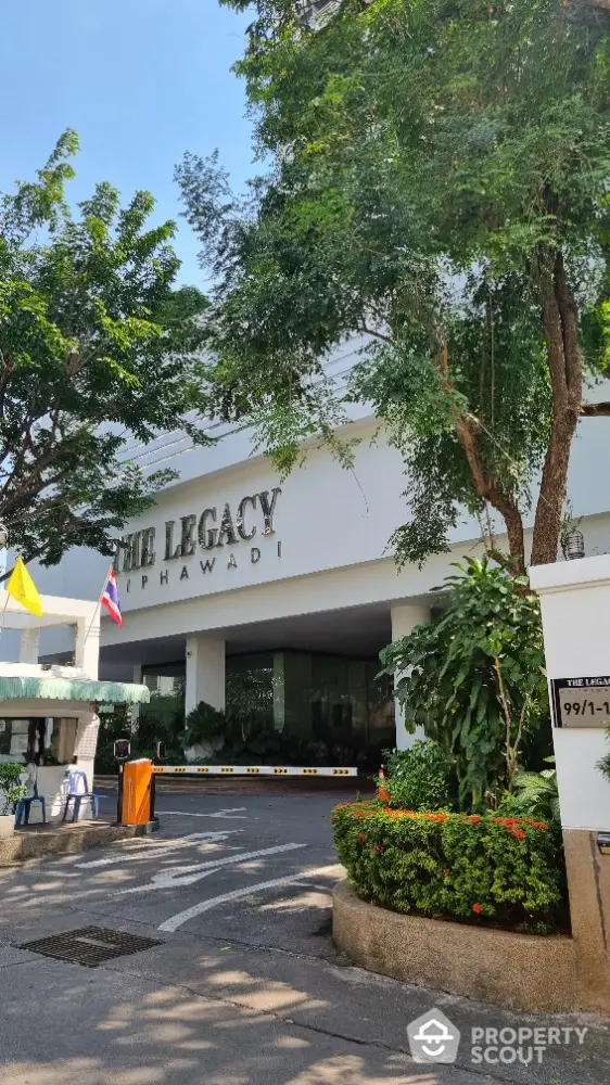 Welcome to The Legacy, a prestigious residential building surrounded by lush greenery and well-manicured gardens, offering a serene entrance that promises luxury and tranquility.