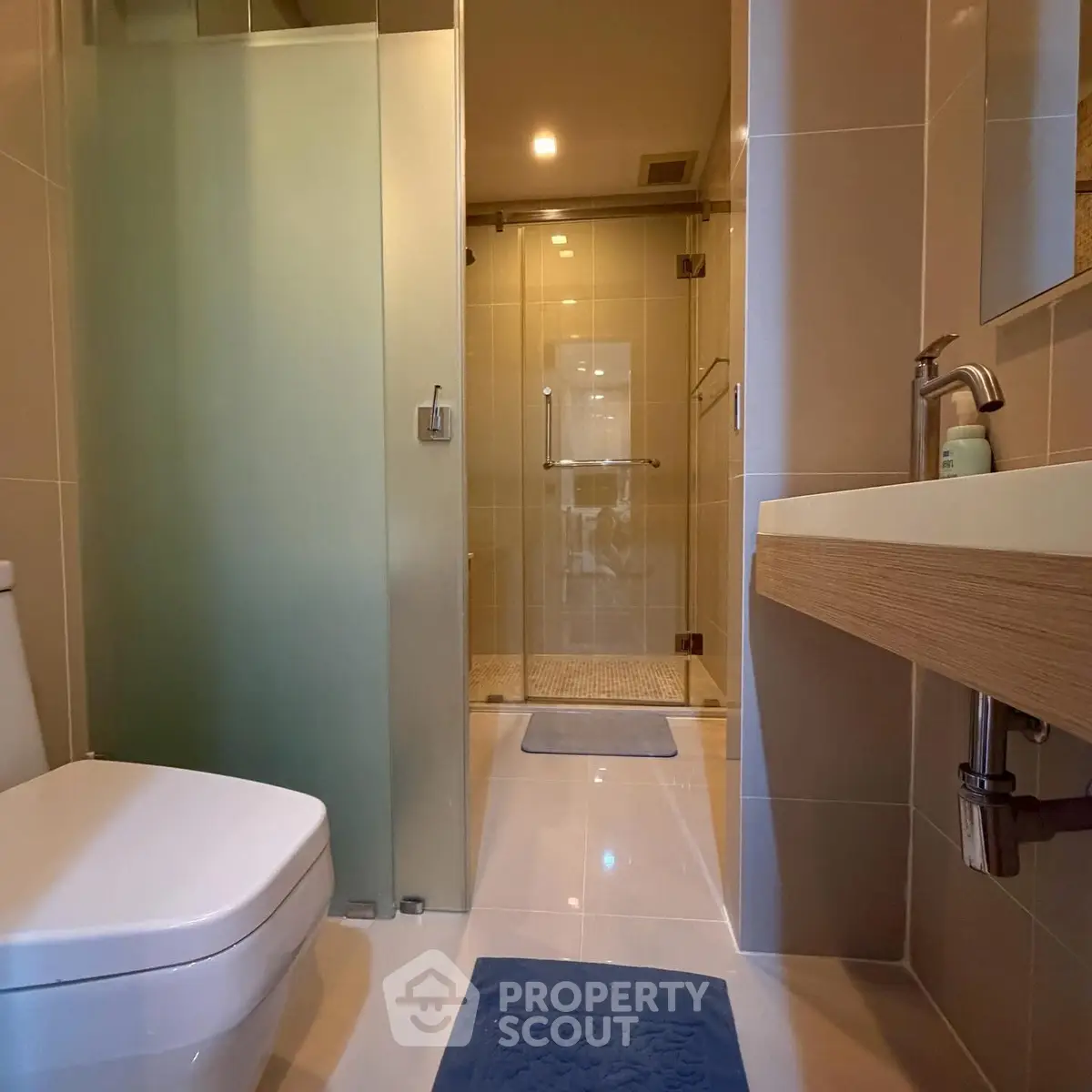 Modern bathroom with glass shower and sleek fixtures