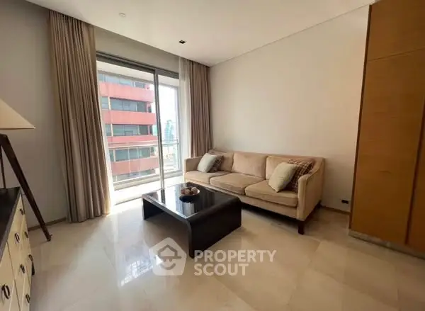 Modern living room with natural light and city view, featuring a cozy sofa and elegant decor.