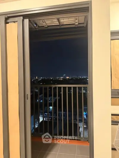 Stunning night city view from a high-rise balcony, perfect for urban living.