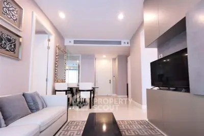 Modern living room with sleek design and elegant decor, featuring a comfortable sofa and stylish dining area.