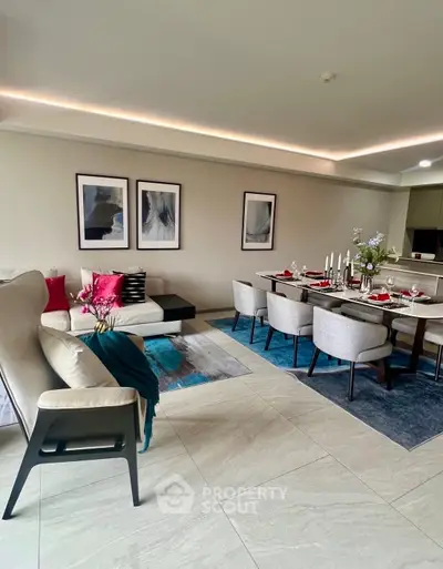 Elegant living and dining area with modern decor and stylish furniture.