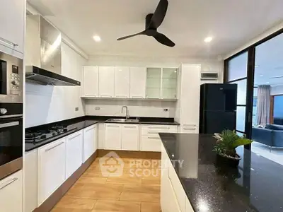 Modern kitchen with sleek black countertops and open layout design