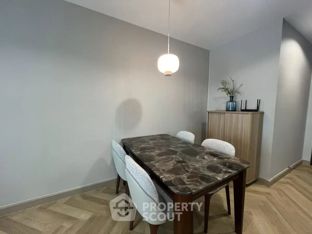 Elegant dining area with modern table and chairs, perfect for stylish home gatherings.