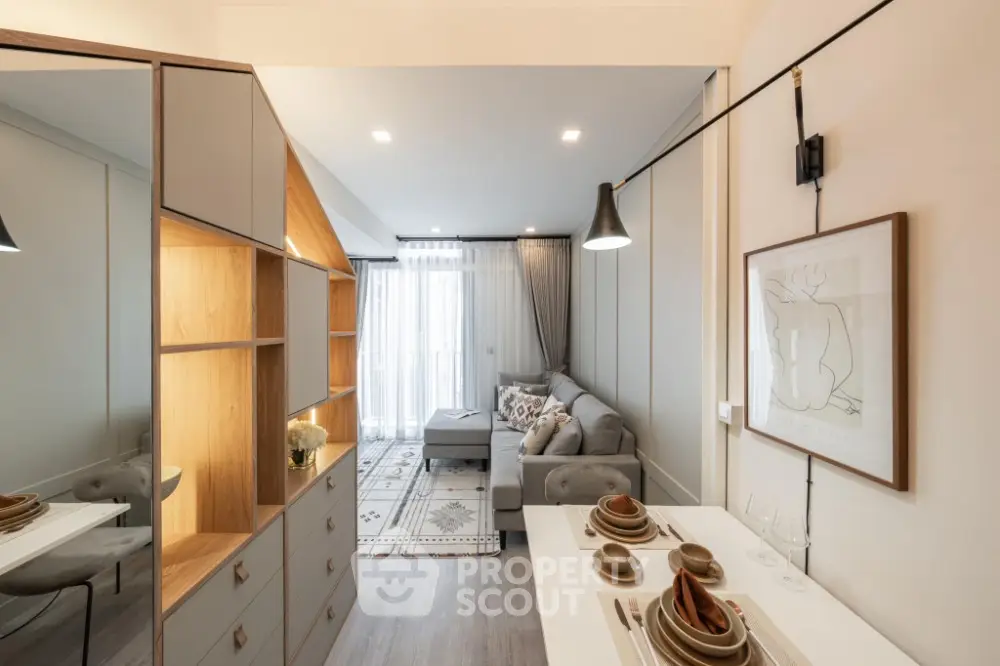 Modern living room with stylish decor and open layout, featuring cozy seating and elegant dining area.