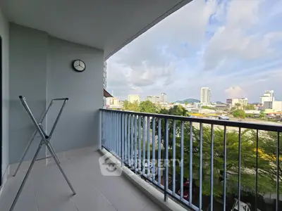 Spacious balcony with city view, perfect for relaxation and enjoying urban scenery.