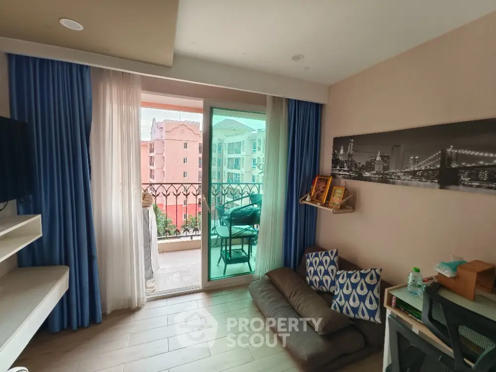 Cozy living room with balcony view in modern apartment