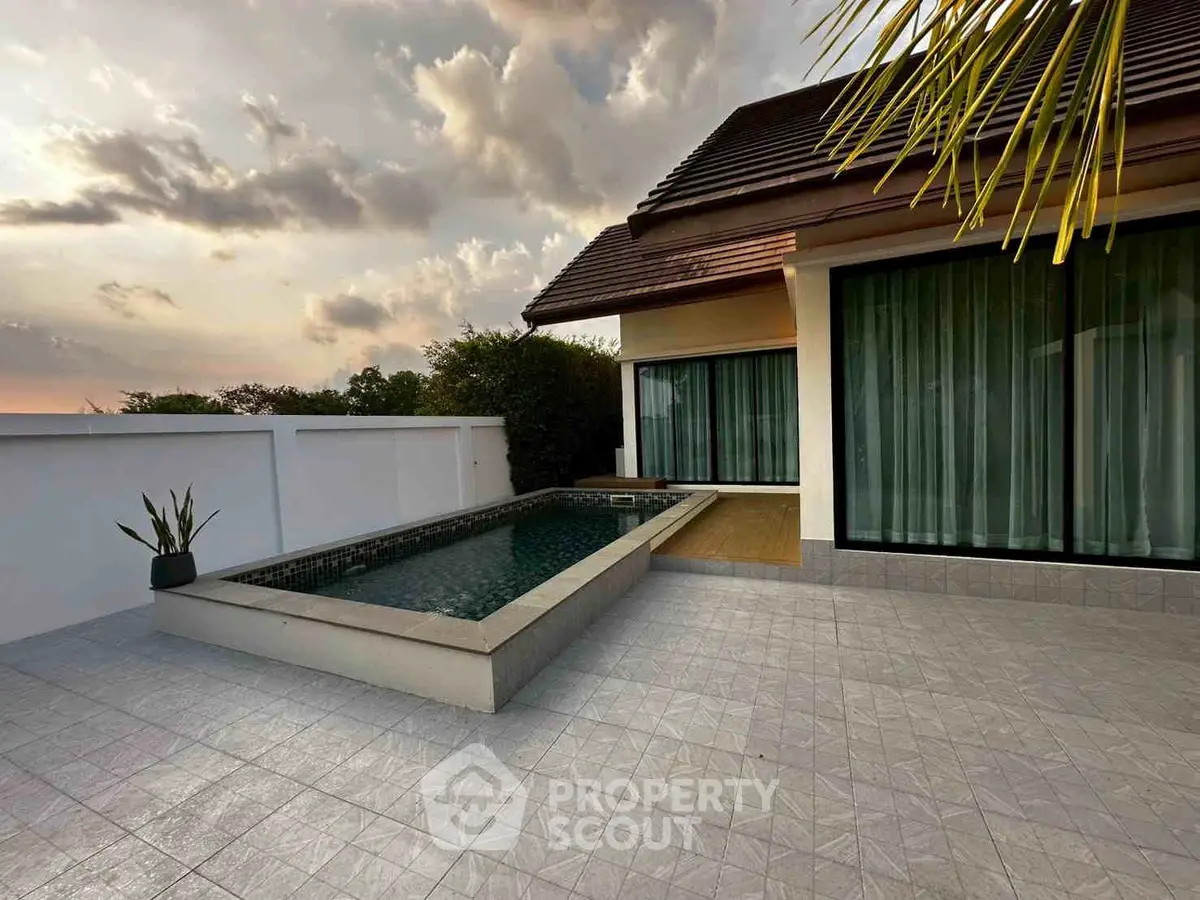 Luxurious villa with private pool and modern design at sunset