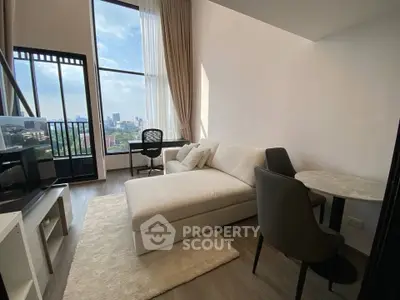 Modern living room with city view, featuring a cozy sofa and dining area in a high-rise apartment.