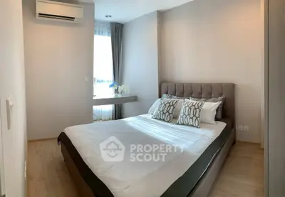 Modern bedroom with stylish decor and natural light