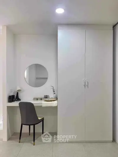 Minimalist bedroom with sleek wardrobe and stylish vanity area