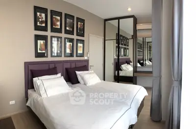 Modern bedroom with twin beds and stylish decor in a contemporary apartment.