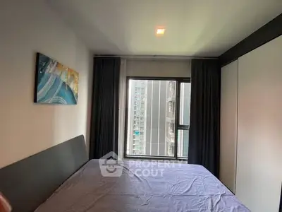 Modern bedroom with large window and city view