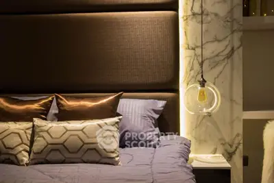 Luxurious bedroom with elegant lighting and plush bedding