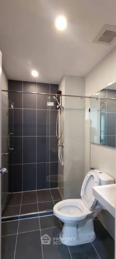 Modern bathroom with sleek glass shower and contemporary fixtures