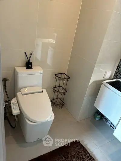 Modern bathroom with sleek toilet and stylish decor