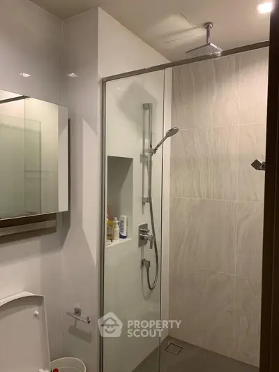 Modern bathroom with glass shower and sleek fixtures