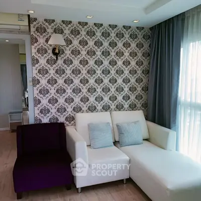 Stylish living room with elegant wallpaper and modern furniture